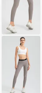 Detail showing the fit and design of these grey high-waist yoga pants for women