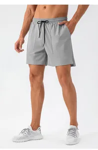 Grey men's quick-dry sports shorts with elastic drawstring waist and side pockets.