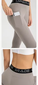Detail view of high-waist yoga leggings with functional side pocket and elastic waistband