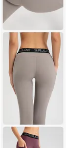 Detail view of high-elastic yoga pants featuring butt-lifting design and side pockets.