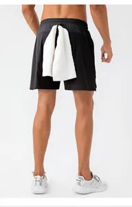 Back view of men's black quick-dry athletic shorts featuring a functional towel loop