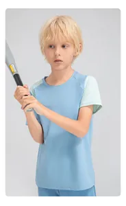 Close-up of a boy wearing a blue and mint green color-blocked sports T-shirt holding a bat