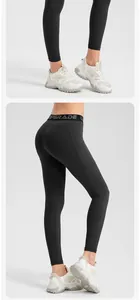 Detailed side view of black high-waisted yoga leggings featuring convenient side pockets