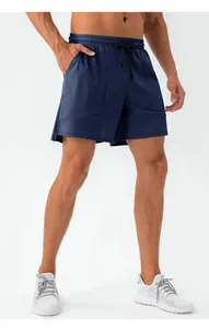 Detailed view of men's loose navy blue athletic shorts with drawstring waist.
