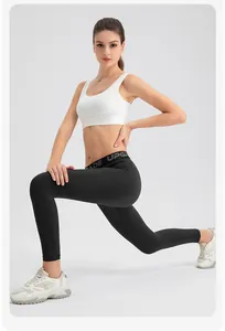 Detail of high-waisted black yoga leggings for women shown on a professional model