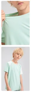 Close-up showing the breathable fabric and neckline detail of boy's mint sports T-shirt