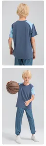 Front and back views of a boy's breathable color-block sports T-shirt and pants set