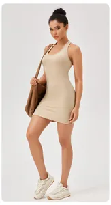 Detailed view of backless beige fitness dress with built-in pads for yoga and tennis