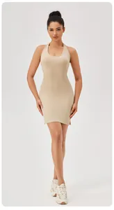 Detailed view of women's beige ribbed athletic dress with a halter neck and slim fit.