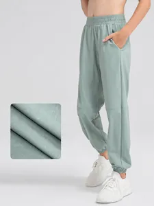 Pantalon de sport ample à séchage rapide pour garçons pour la course à pied en vert sauge