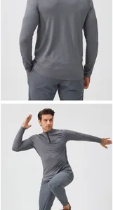 Detailansicht der Rückseite und Vorderseite eines grauen Lauf-Sweatshirts mit Reißverschluss.