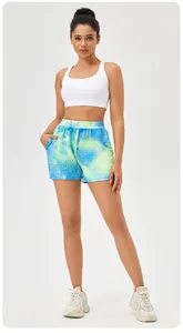 Detail view of women's high waist quick-dry tie-dye sports shorts with honeycomb waffle texture