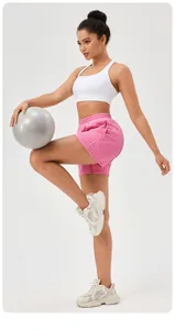 Women's pink honeycomb textured high waist athletic shorts for yoga and running