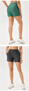 Macro detail of high-waist mesh yoga shorts showing the front and back athletic fit