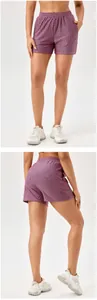 Front and back view of women's pink patterned high-waist quick-dry sports shorts