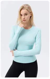 Detail view of light blue long-sleeve sun protection yoga top with breathable fabric