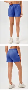 Front and back detail view of royal blue high-waisted textured athletic yoga shorts