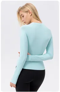 Back view of light blue slim fit sun protection yoga top showing cooling fabric