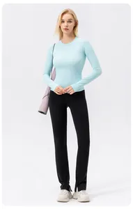 Close-up shot of a light blue long-sleeved sun protection yoga T-shirt for sports women