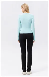 Back view of women's light blue long sleeve slim fit yoga top for sun protection