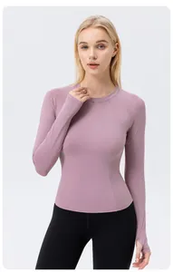 Slim fit women's sun protection yoga long sleeve shirt in mauve pink with thumb holes