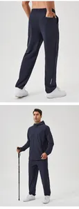 Detailed view of men's quick-dry navy sports suit with hooded jacket and straight pants.