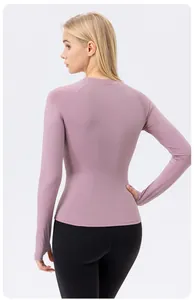 Back view of women's UV protection tight yoga top in mauve with thumb hole details