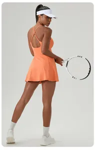 Back view of orange quick-dry tennis dress with criss-cross straps for women