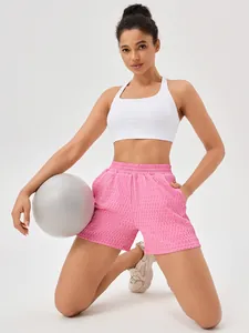 Loose high-waist athletic shorts for women running and yoga in pink textured fabric
