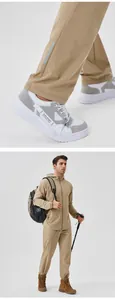 Close-up of men's khaki sports pants with reflective strip and full outdoor tracksuit view