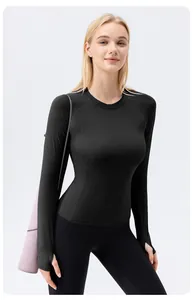 Front view of black long-sleeve athletic yoga top with thumbholes on model