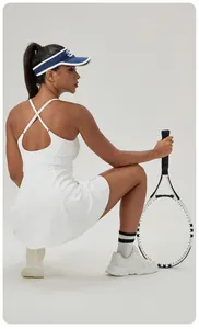 White women's athletic tennis dress with chest pads and stylish cross-back detail