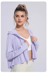 Side view showing the breathable fabric of a light purple sun protection jacket