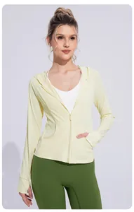 Detail view of a light yellow cooling ice silk sun protection jacket with hood and zipper