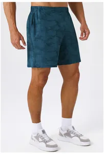 Macro view of men's cooling quick dry sports shorts with elastic waist on a model