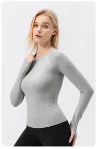 Grey slim fit long sleeve sun protection yoga shirt for women with breathable fabric