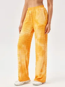 Brede sportbroek voor dames in oranje tie-dye met getextureerde elastische stof