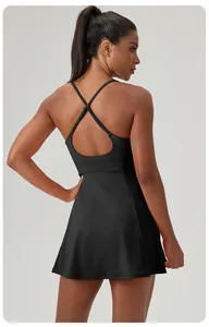 Back view of a black quick-dry tennis dress with cross-strap design for women