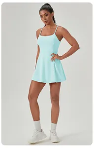 Women's light blue athletic tennis dress with spaghetti straps and built-in pads.