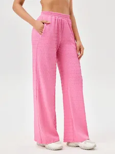 Roze getextureerde sportbroek met wijde pijpen voor dames voor fitness en hardlopen