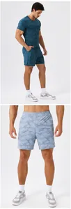 Close-up detail of men's breathable camo print quick-dry elastic sports shorts.