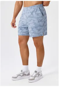 Detail view of men's cooling printed sports shorts with elastic waist and side pockets.