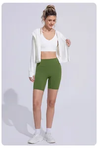 Woman wearing a white hooded ice silk sun protection jacket paired with olive green shorts