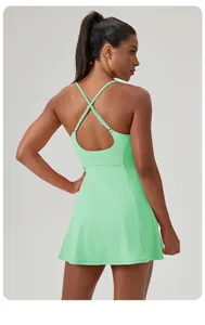 Back detail of mint green athletic tennis dress with criss-cross straps for women