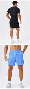 Detail views of men's quick-dry camo sports shorts in black and blue colors