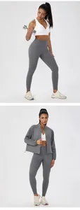 Full view of grey high-waisted yoga leggings paired with a matching zip-up jacket