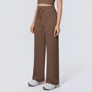 High-waisted wide-leg brown yoga pants featuring a drawstring waist and loose fit.