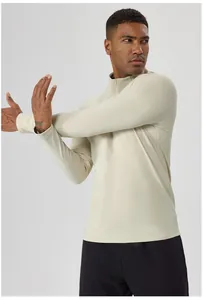 Men's athletic half-zip thermal long sleeve top in cream for outdoor running and gym