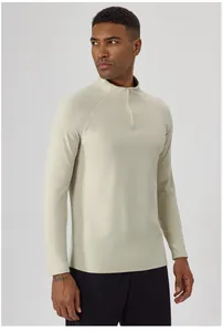Close-up of men's beige half-zip athletic long sleeve shirt for autumn and winter