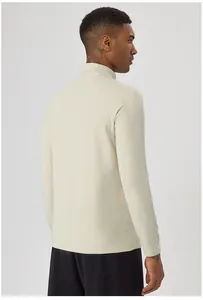 Detailed back view of men's half-zip thermal long sleeve sports top for running.